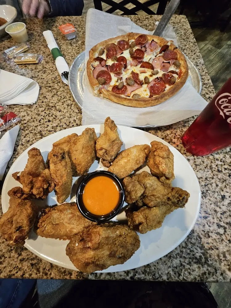 Chicken Wings and Meat Lovers Pizza